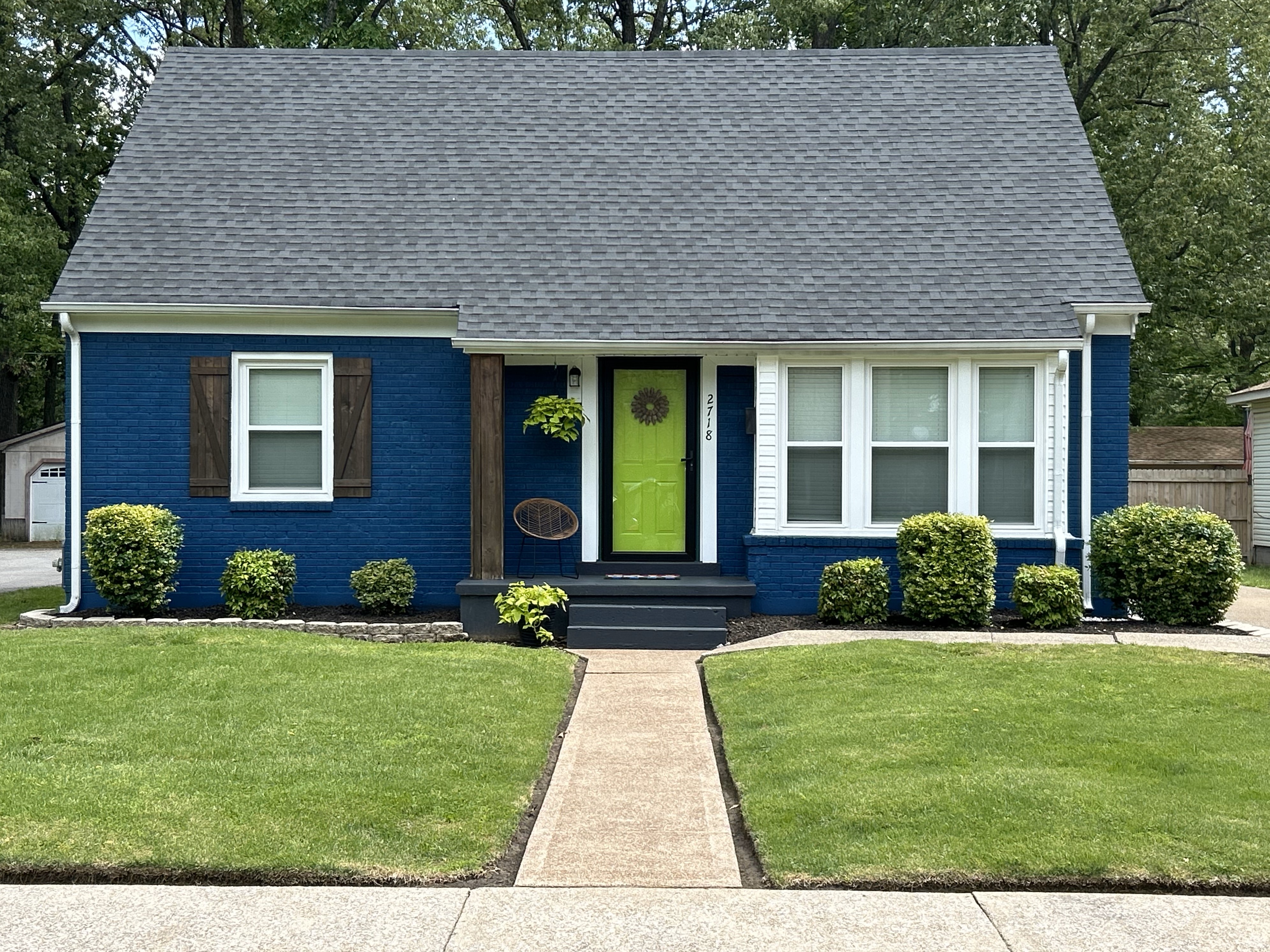 home of Stacie Byrd. House is painted royal blue with a bright lime green front door.